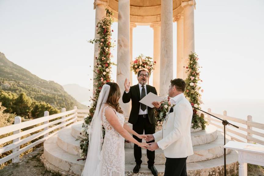 A serene mountain wedding ceremony, featuring a couple exchanging vows amidst breathtaking natural scenery.